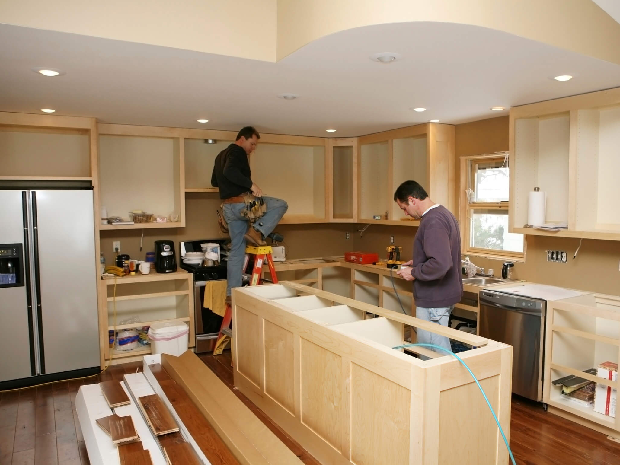 Oregon home with contractors renovating kitchen
